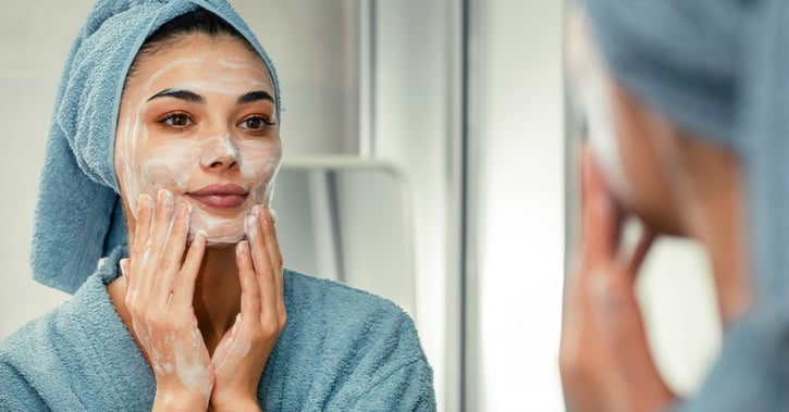 Woman washing her face_1200x628