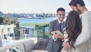 Agent showing tablet on rooftop