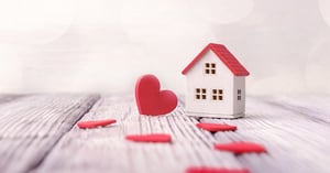 Toy house and red hearts
