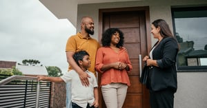Family talking to the real estate agent
