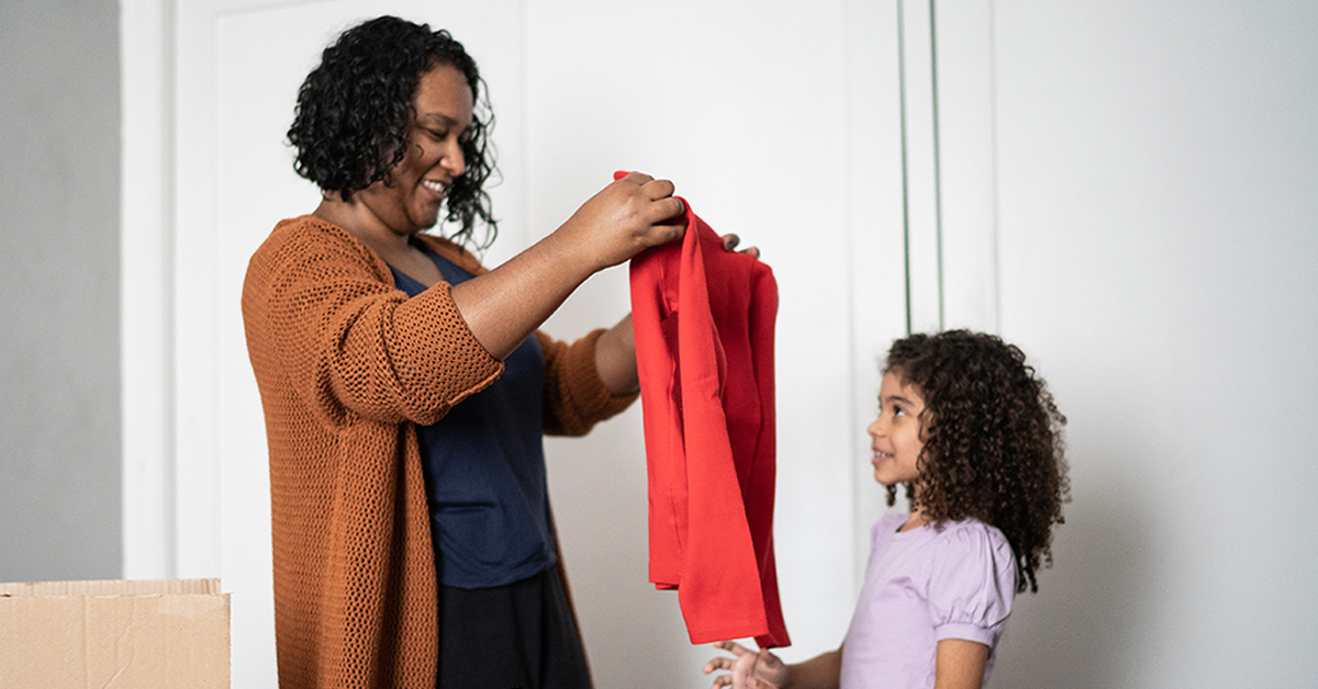 Mother and daughter sorting out clothes