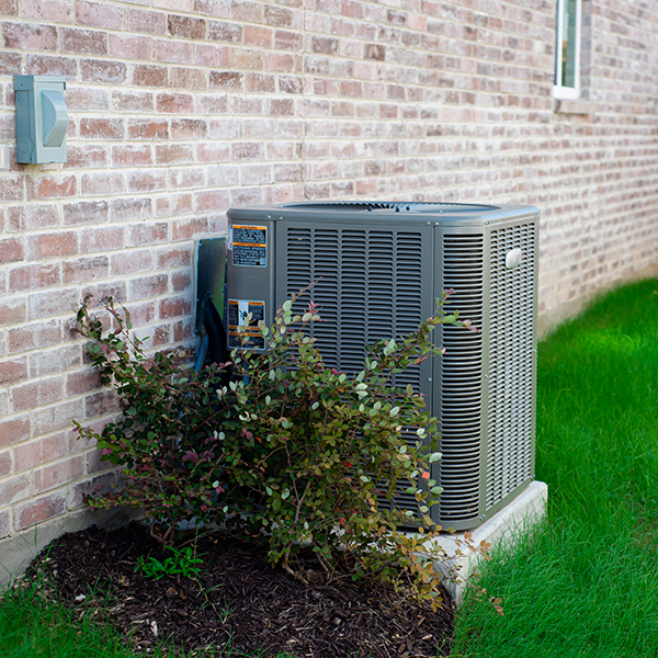 Air conditioning unit on the exterior of a home Air conditioning unit on the exterior of a home