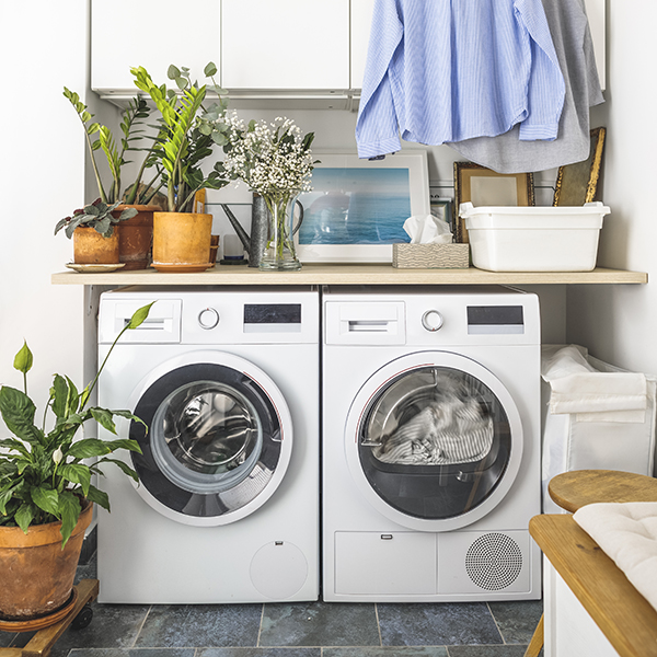 A washer and dryer in a home's laundry room. A washer and dryer in a home's laundry room.